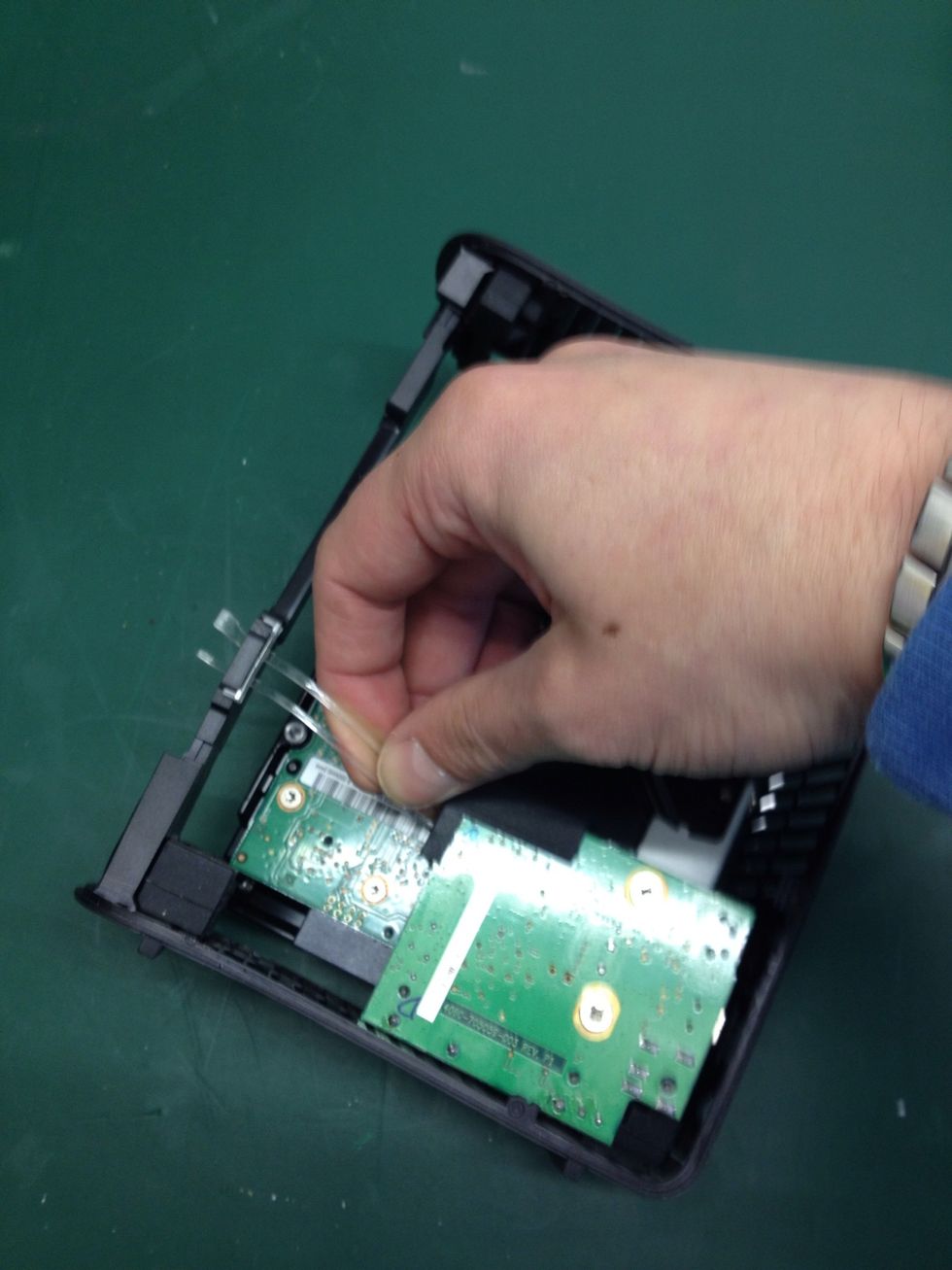 Pull this out of place and again, set it aside. Be careful not to snap it!!