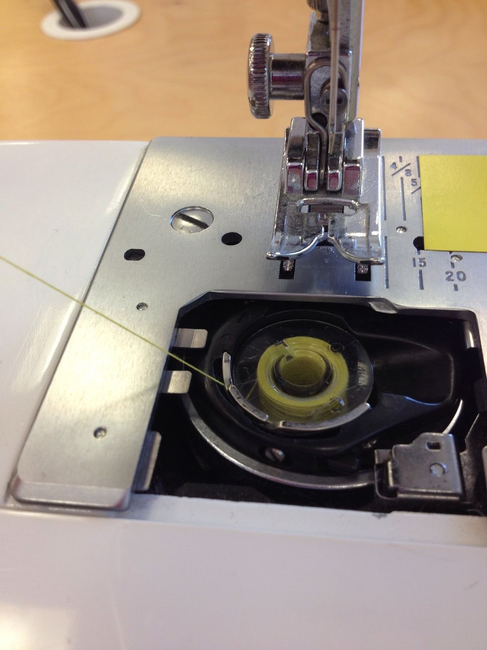 Pull thread up to the left.