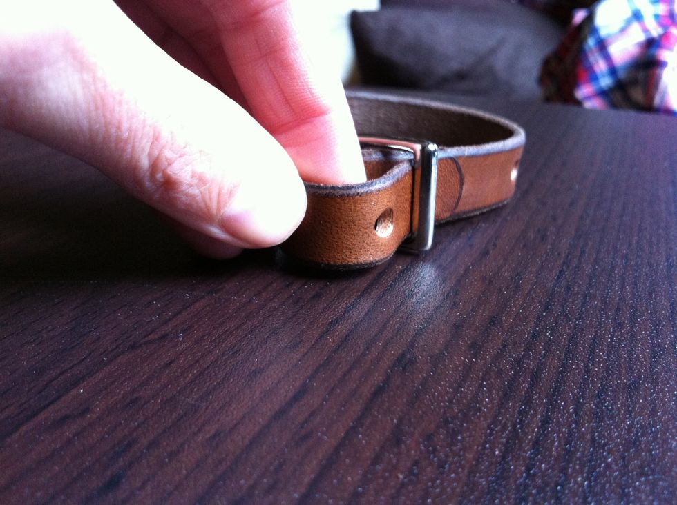 Pull through the other side of the buckle