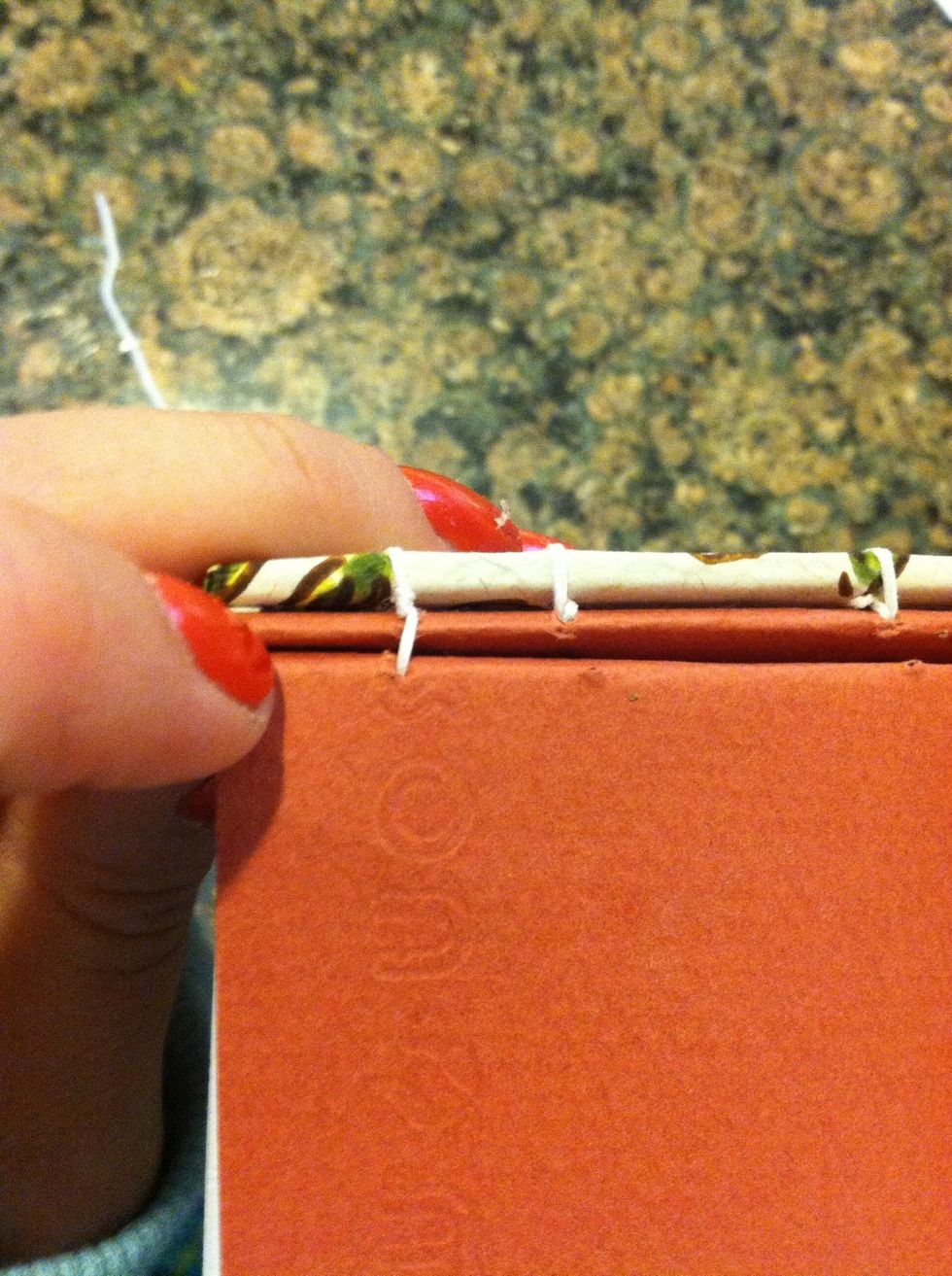 Pull tight... Like so. Then on the inside go to the next station puts needle through pull tight.