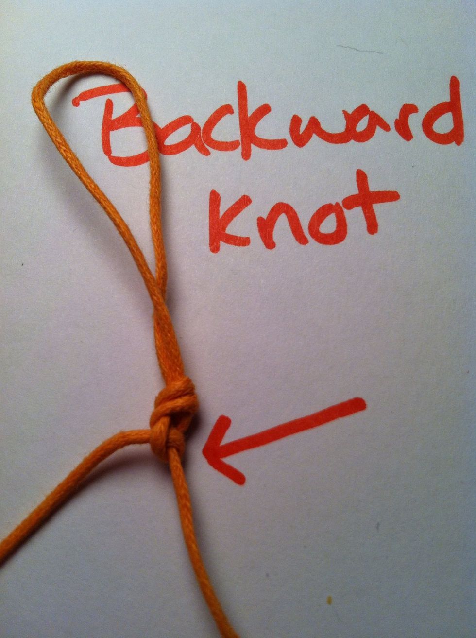 Pull tight up and to the left. Repeat once for a full backward knot.