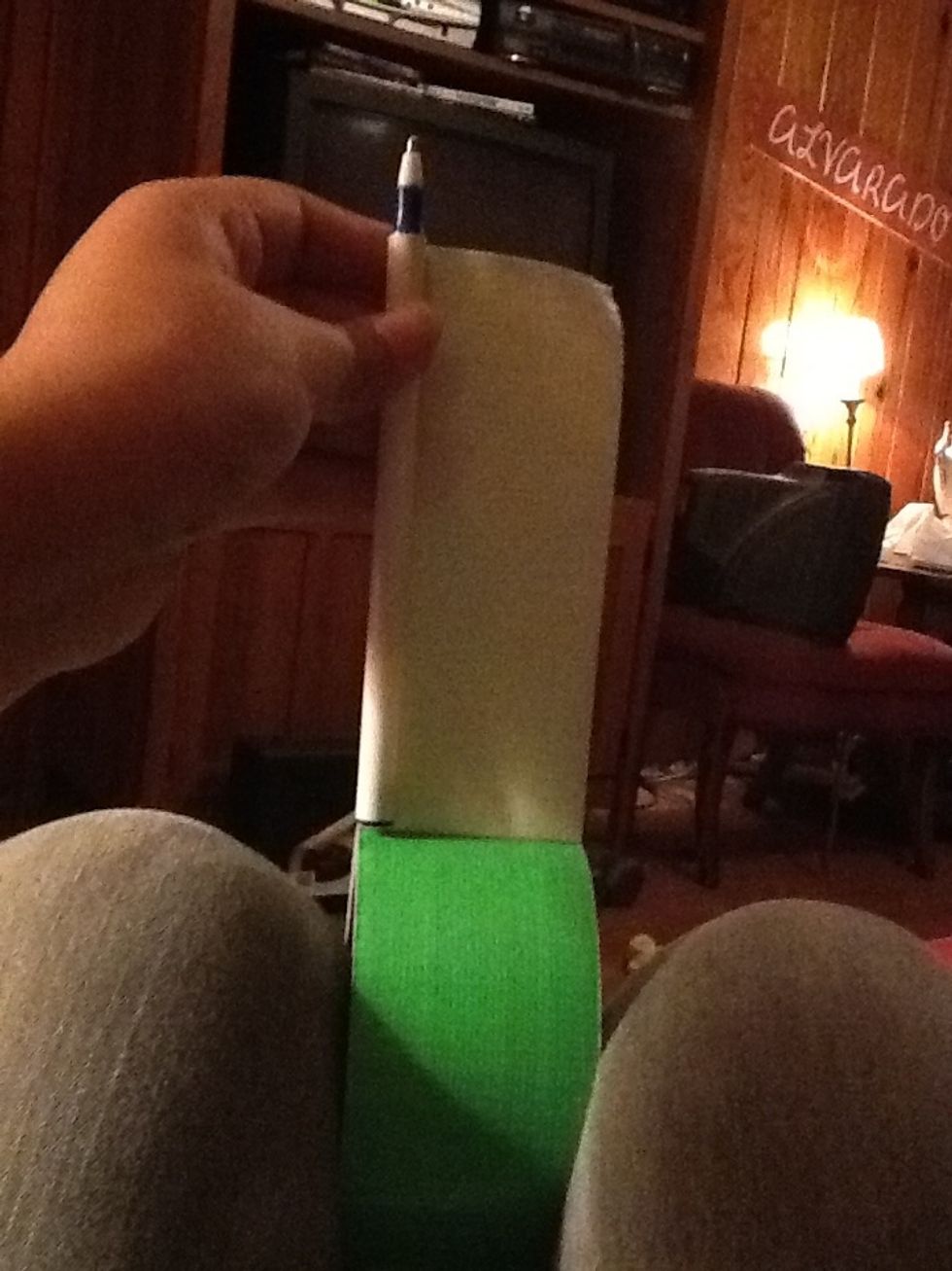Pull up some duct tape and put the pen onto it length wise. This will be your stem, so I chose green :)