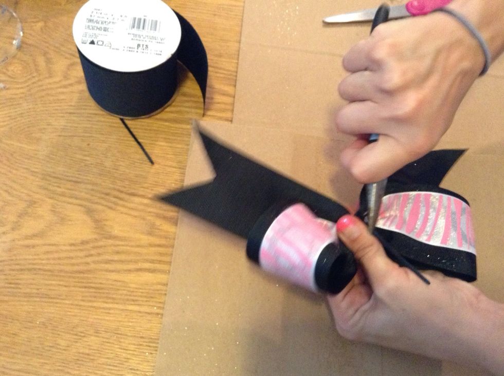 Pull upwards on the excess piece of zip tie to ensure no more movement.