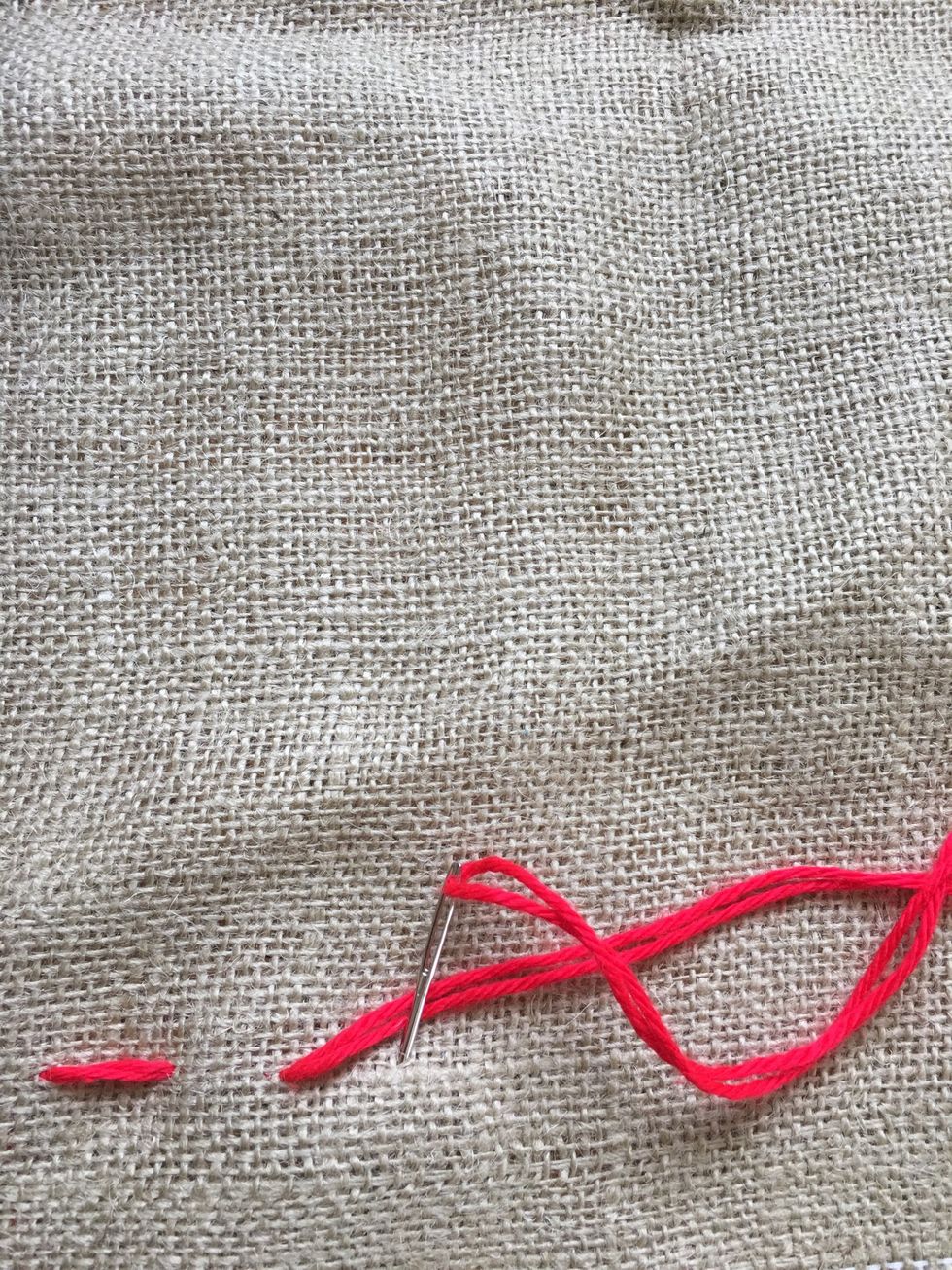 Pull yarn all the way through.  Go down from the front.