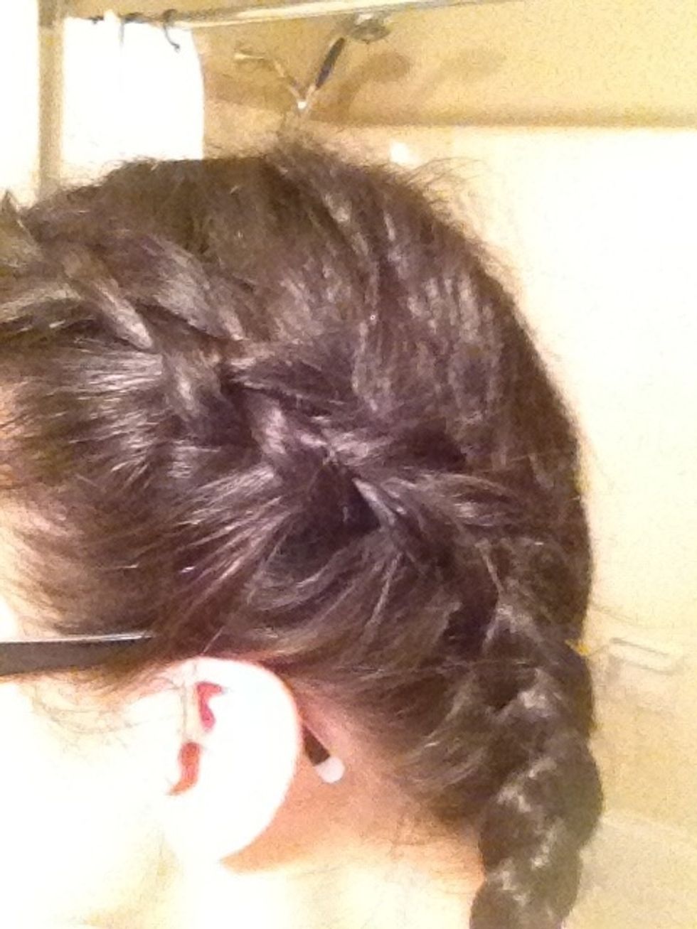 Pull your braid tight as you go, and each time you cross a section pull your hand down the length of the strand to separate it from random hairs. Braid until it starts getting very small and secure.