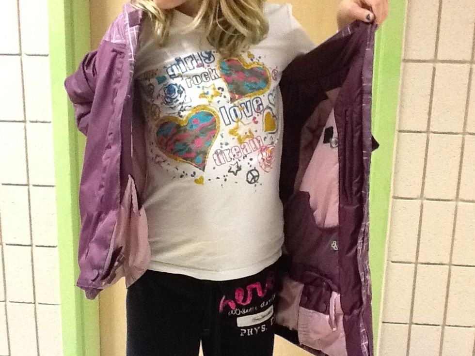 Pull your coat to the other side of your body.