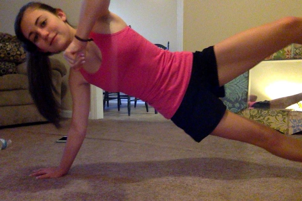 Pull your left elbow to the ceiling. As you do, raise your left leg. Slowly lower both, returning to starting position. Thats one rep.