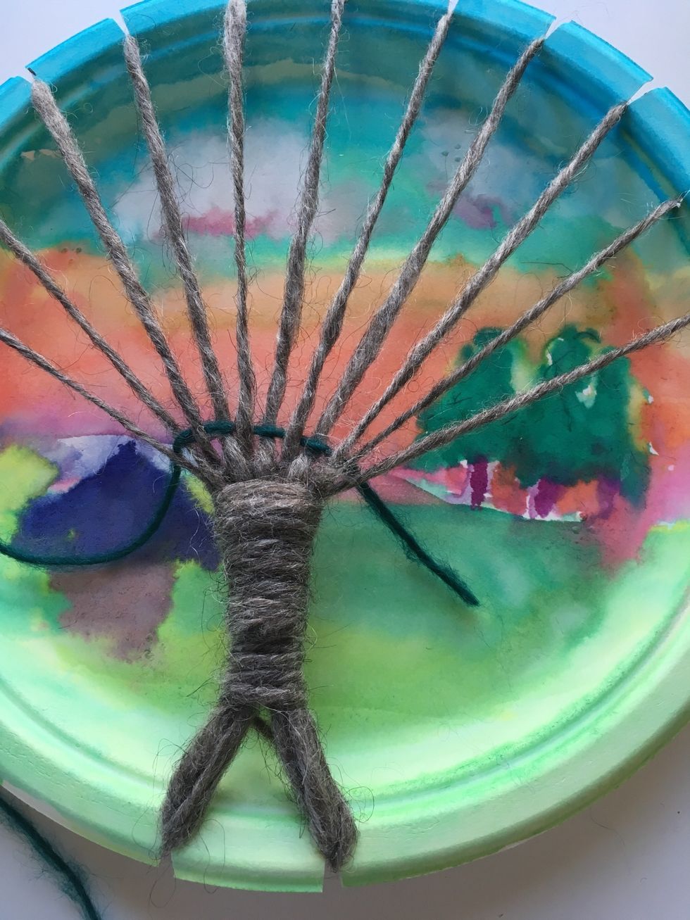 Pull your needle and yarn through until the end of the yarn. Leave a little tail hanging out. We will cut that later.