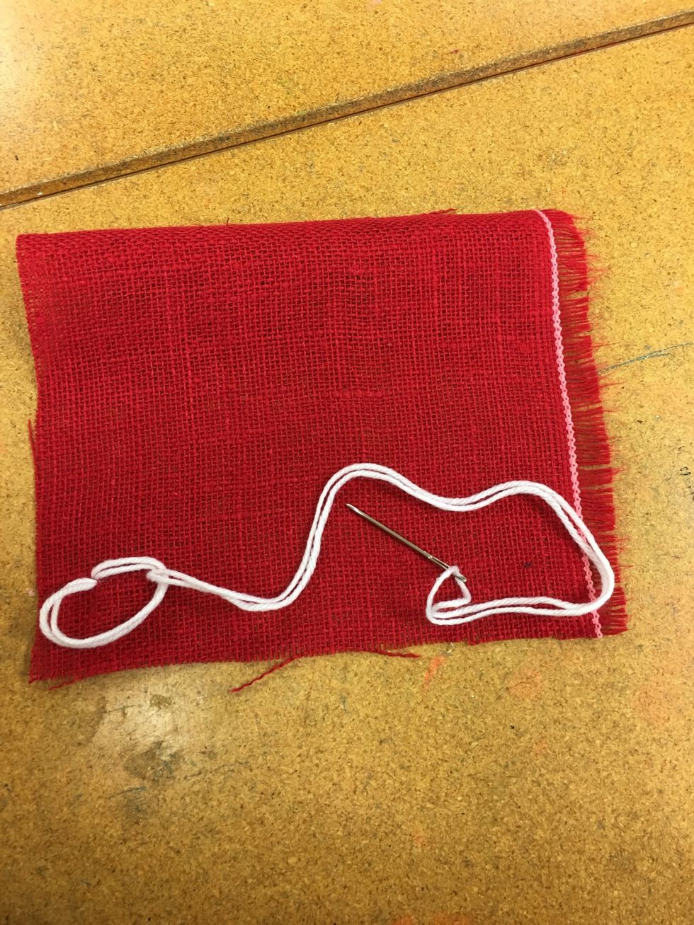 Pull your needle through.