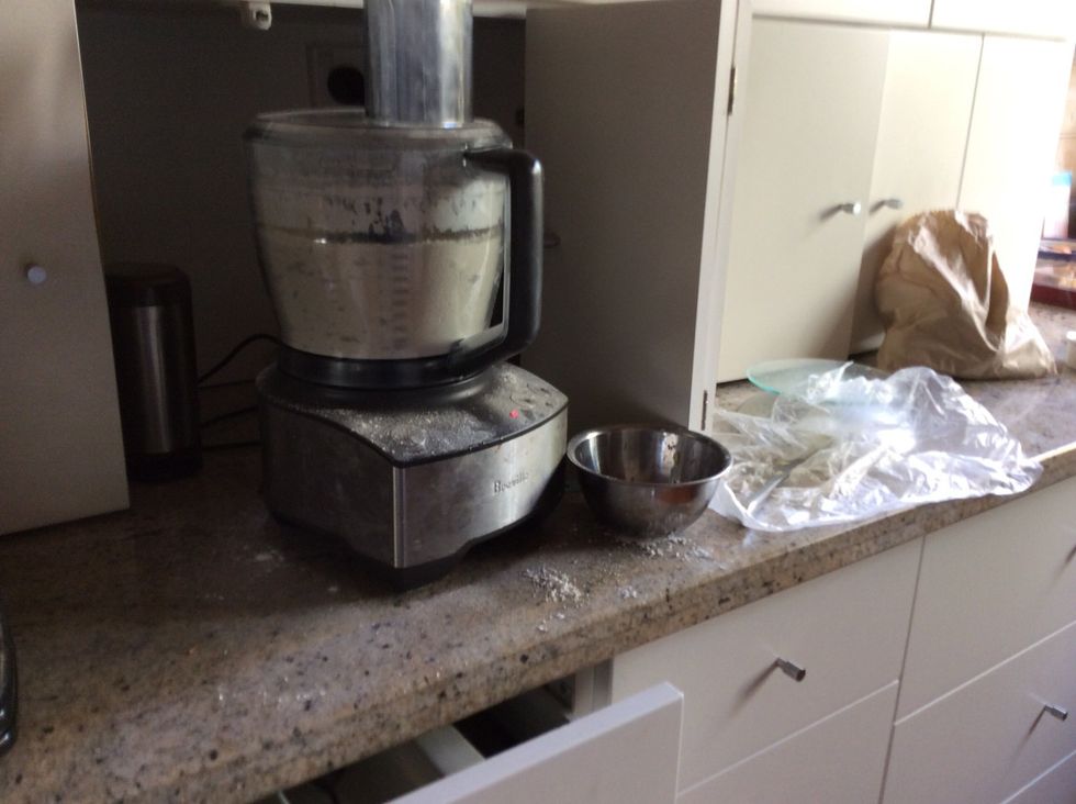 Pulse all of the dry ingredients that make up the pastry: Plain flour, Self-raising flour and icing sugar. Then chop up the butter and blend till bread crumbs. Then add egg yolks, vanilla and water.