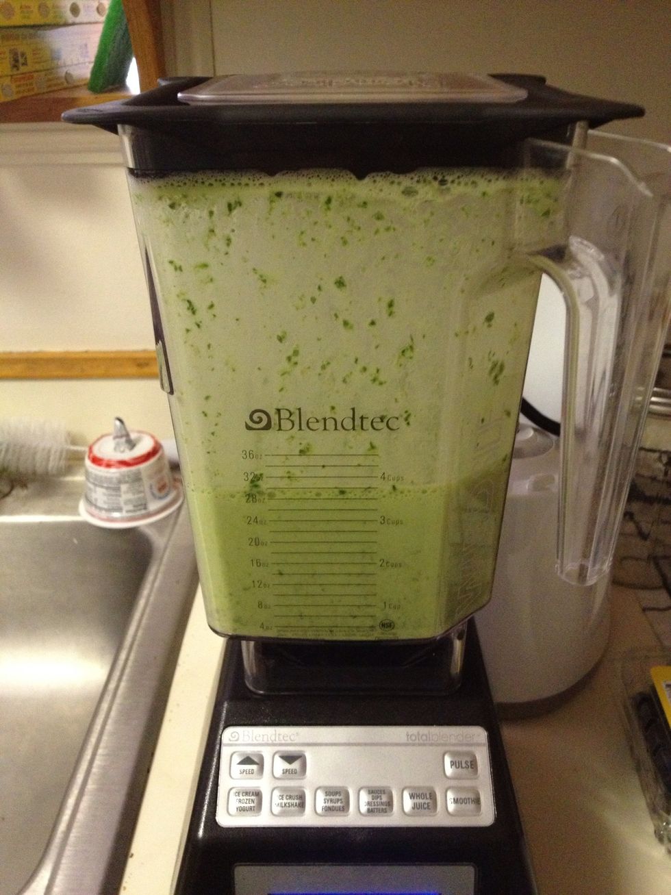 Pulse and blend for a little bit to just break up the greens a little. Don't worry about getting it smooth, we just want to make some room for the other ingredients.