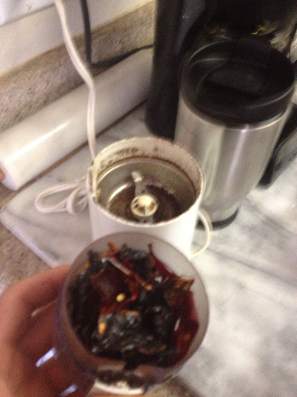 Pulse peppers in batches. Do not overload the grinder and let the motor cool off after several  rounds. Don't worry it cleans pretty easy.