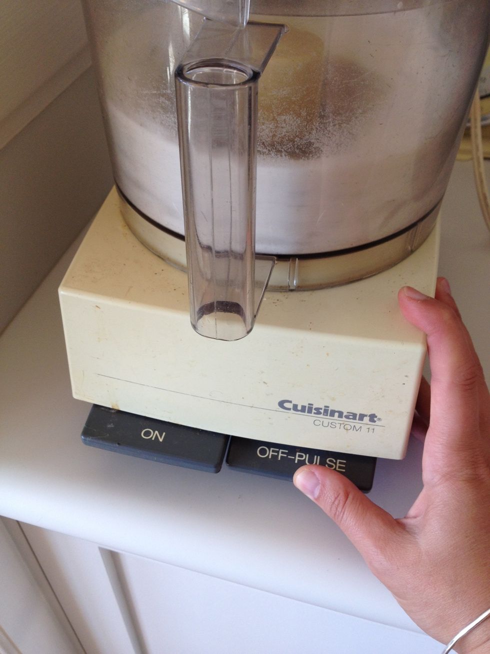 Pulse sugar and vanilla bean pod in a food processor until there are no big chunks of vanilla bean left.