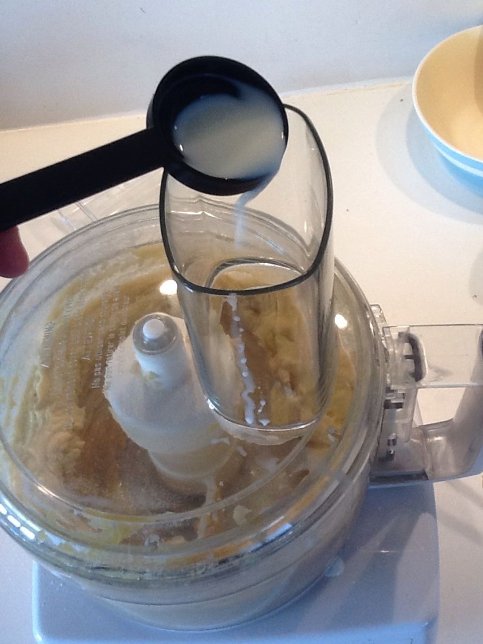 Pulse while pouring the milk into the funnel, to make a smooth dropping consistency.