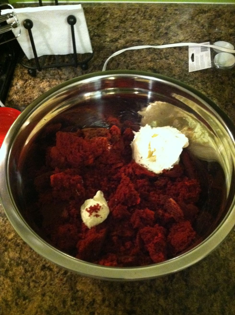 Pulverize cake (so sad to ruin your hard work-but it will be worth it). Then add 1/2 the container of frosting.