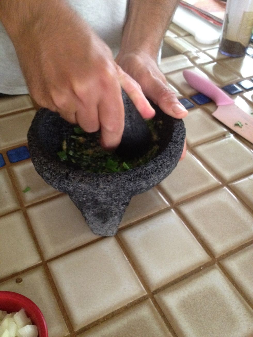 Pulverize into the molcajete.
