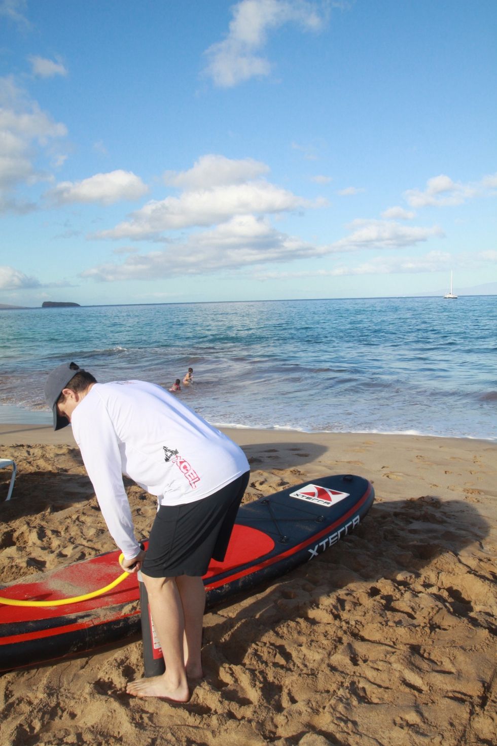 Pump with one or both feet on either side of the base of the pump, and both hands on the handle. If you have a cheap pump your hands need to be close to the hose so you don't snap the handles.