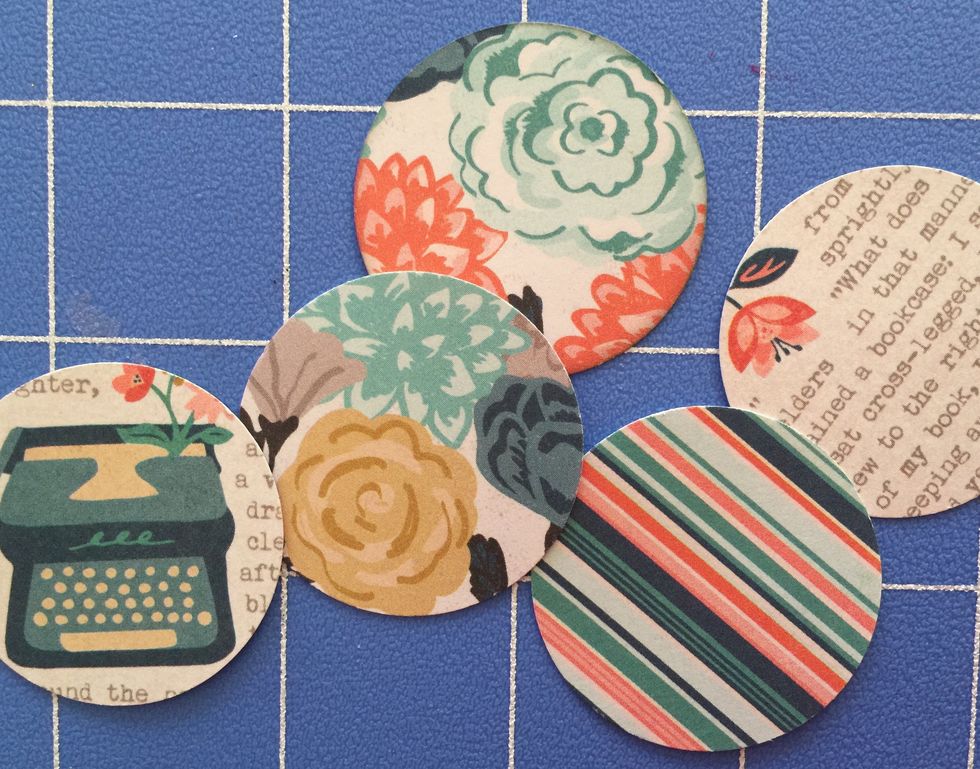 Punch 3 circles using the circle punch, and adhere them side by side on the orange strip of paper. You can find circle punches at www.FotoBella.com