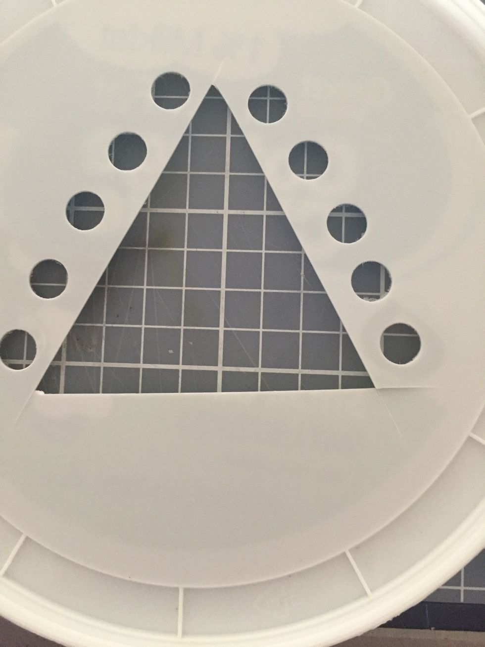 Punch 4-5 holes on two sides of the triangle. Be ready to take over punching b/c little hands get tired punching plastic. \ud83d\udc4b\ud83c\udffc