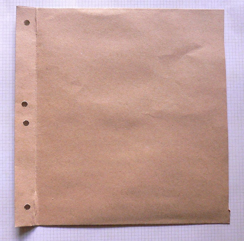Punch 4 holes along each side of the folded part of the all envelopes. Thread ribbons through holes to hold all envelopes together.