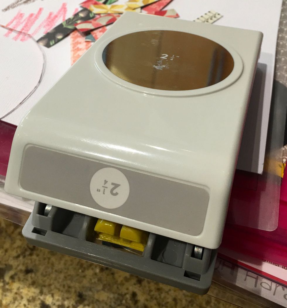 Punch a 3" scallop circle out of black card stock and a 2 \u00bc\u201d circle out of white card stock.