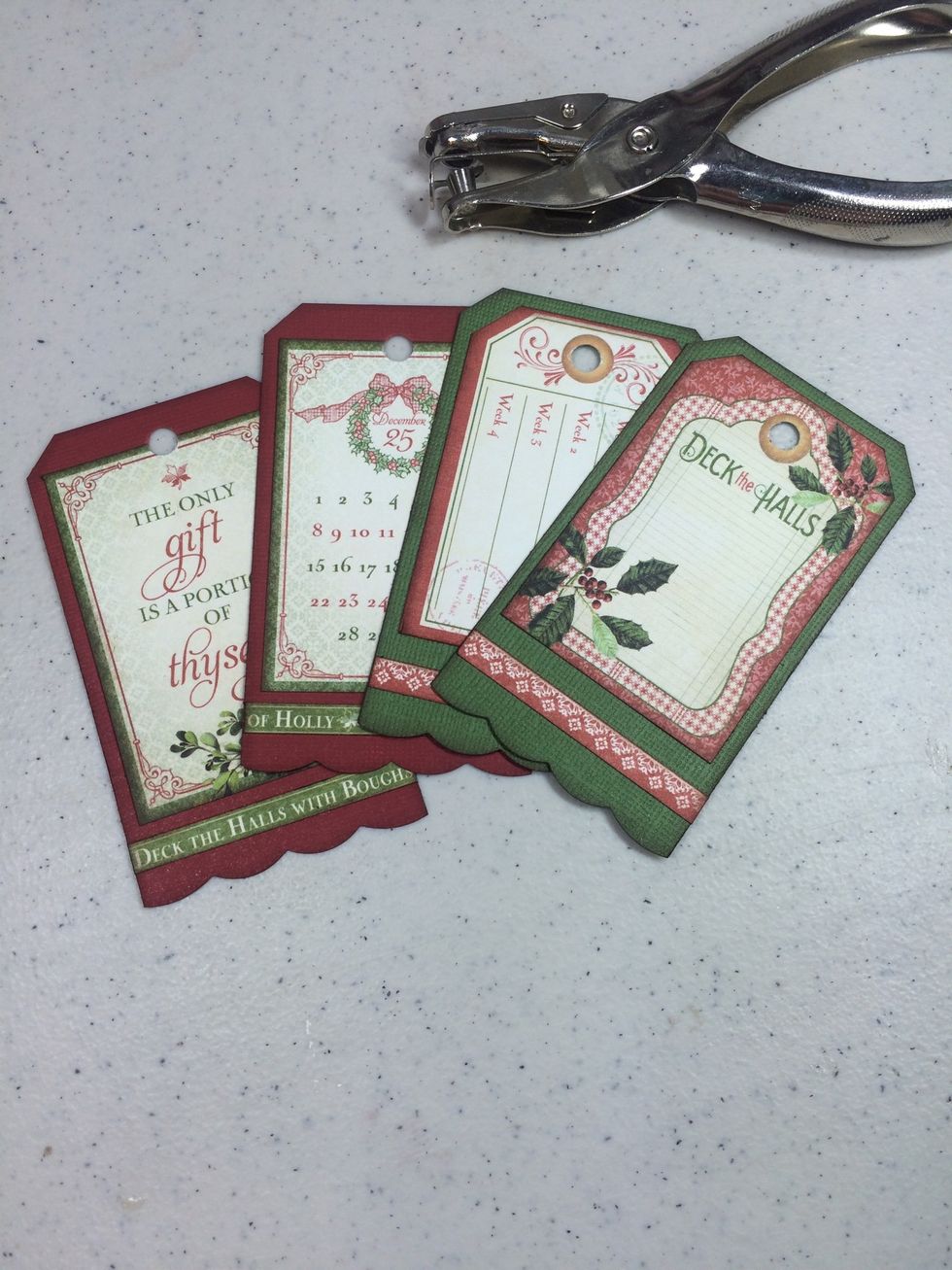 Punch a hole at the top of each tag.