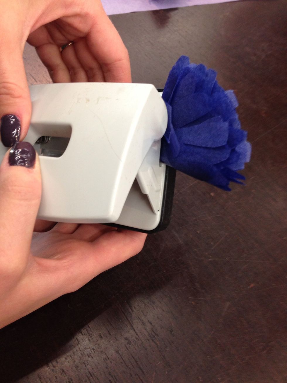 Punch a hole in bottom of the flower