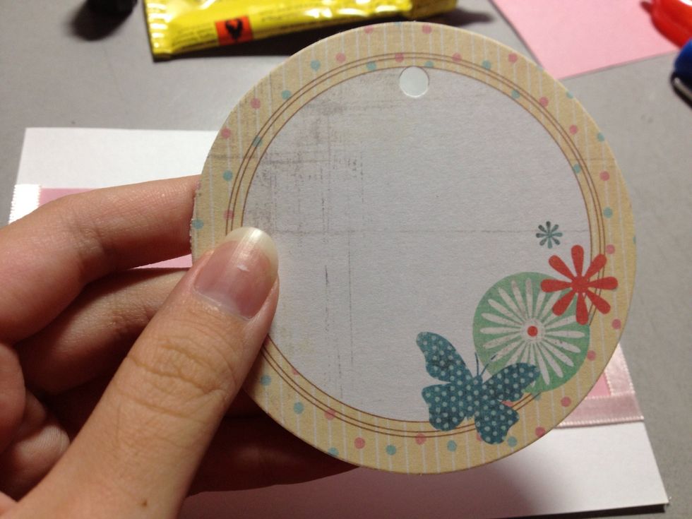Punch a hole in the "gift tag". I bought this card outside but you can easily make your own tag by cutting out your own shape and decorating it, or pop by your craft store and see what you can find.