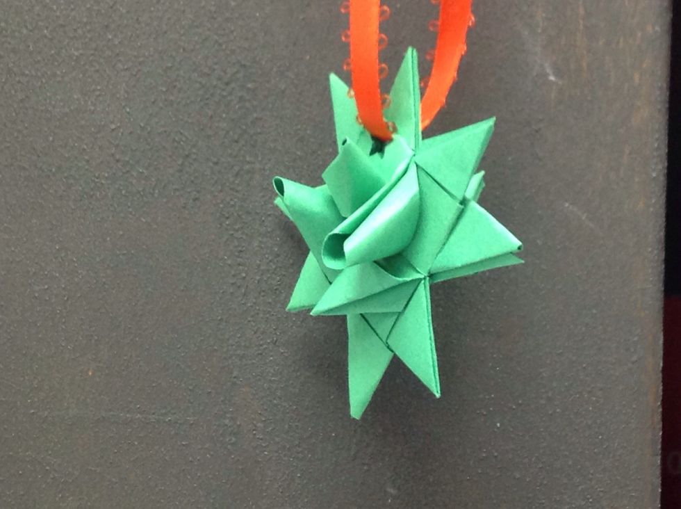 Punch a hole in the star and string with ribbon. Makes a great ornament.