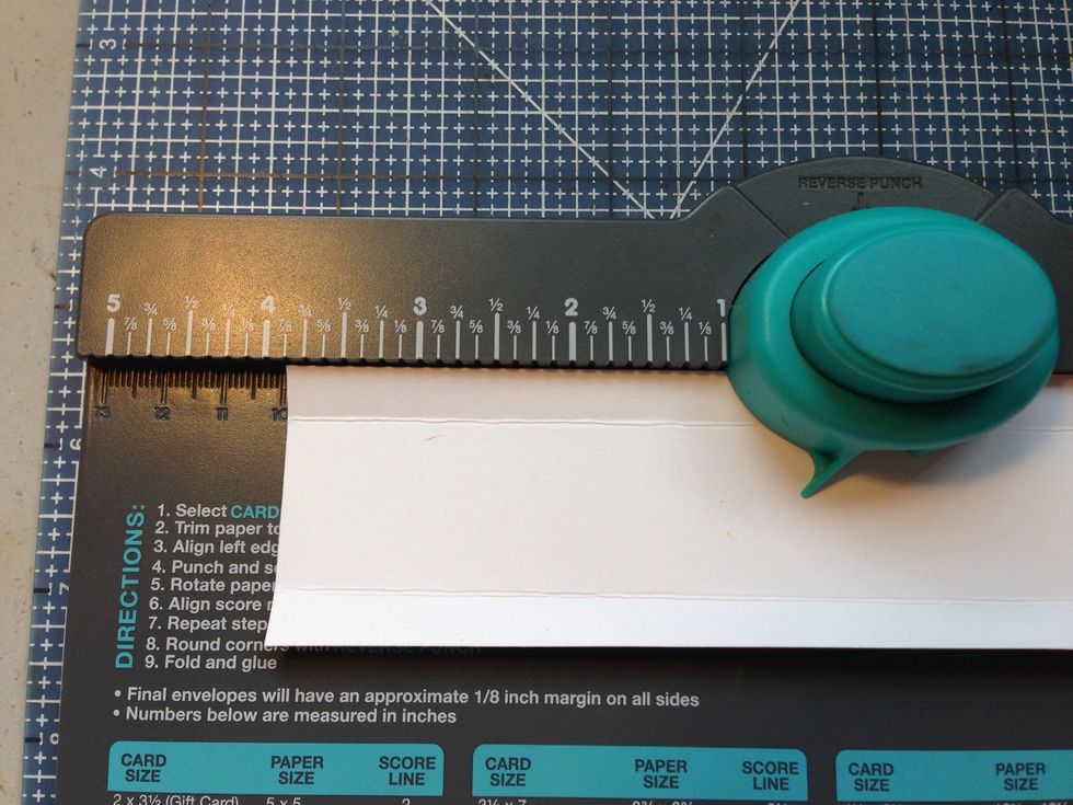 Punch at center (3 7/8" from end) of middle width strip on each fin.