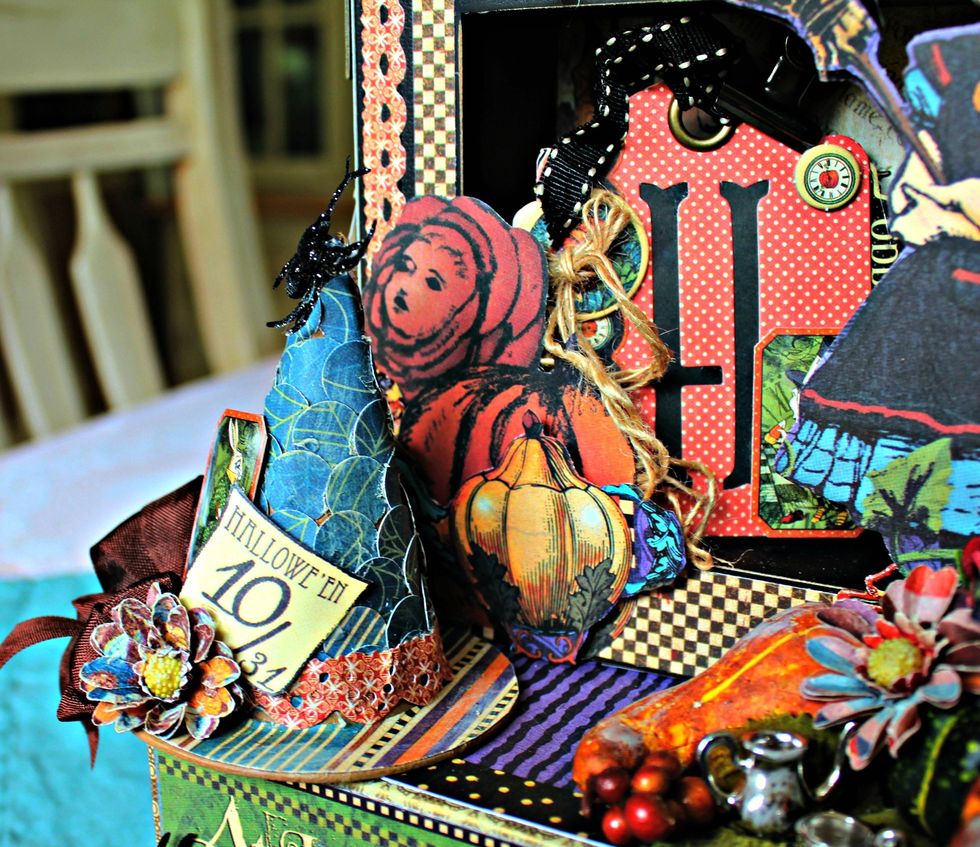 Punch circles and adhere to top of witch hat. Add pattern paper to brim along with banner strip for witch hat band.