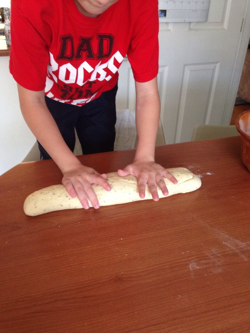 Punch dough down and roll it into a thick rope