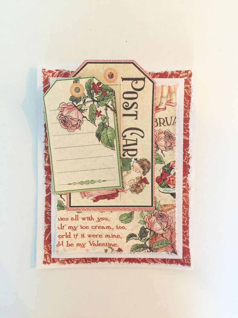 Punch holes on the top of the tags. Layer and adhere to card front, as pictured. Add ribbon now or later.