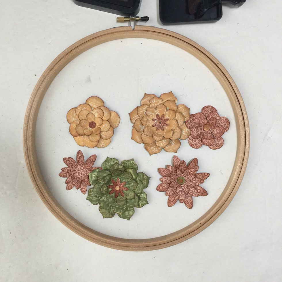 Punch out and assemble die cut flowers as shown or use ready made paper flowers (or make your own from the Time to Flourish 6x6 Pad and a flower die). Use fingers to curl layers. Ink edges if desired.