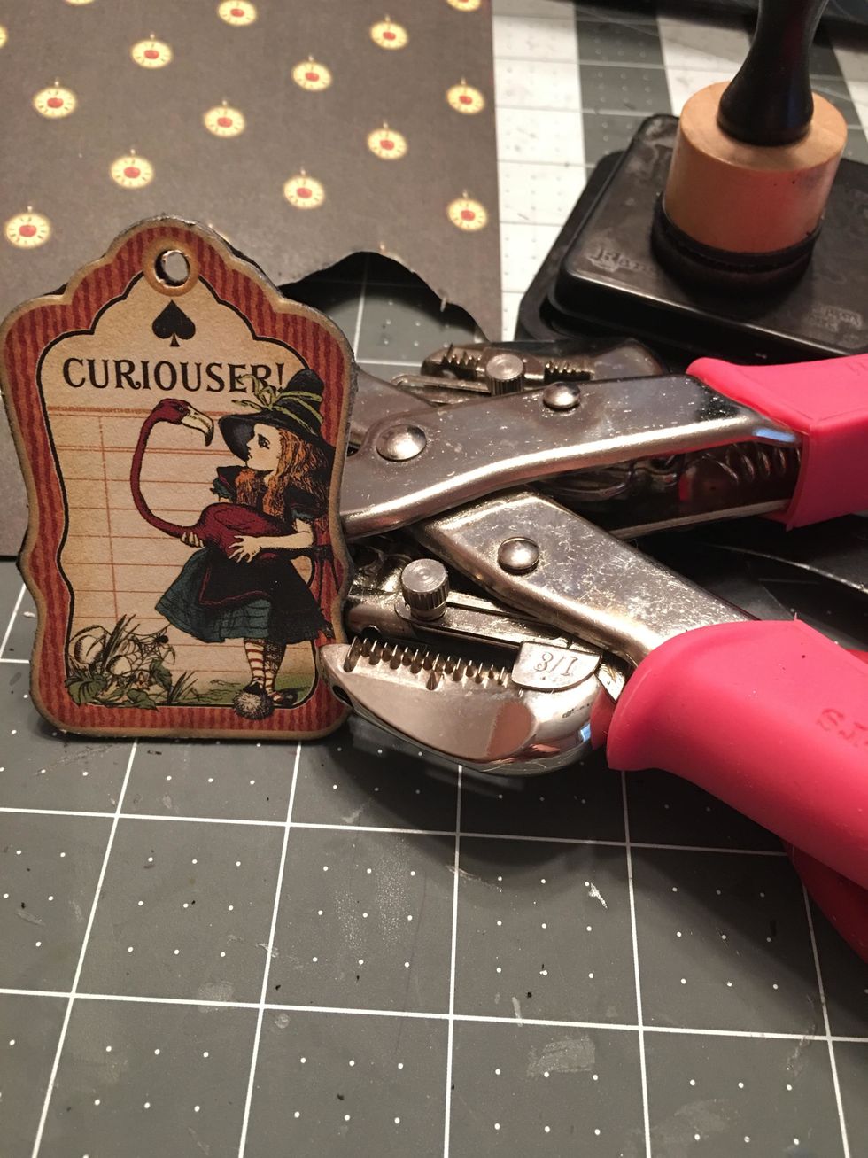 Punch out the hole of the tag where it has been covered with the patterned paper.