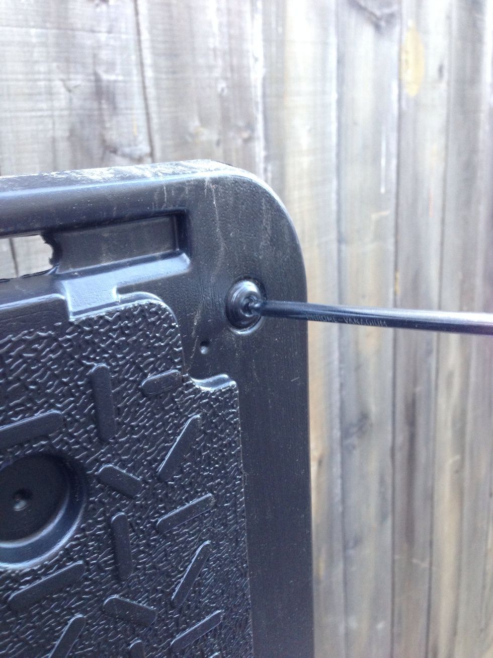 Punch out the holes where the bottoms of the doors will be placed.