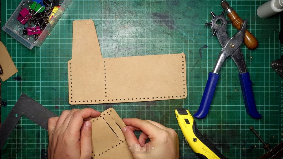 Punch the card slot holes and cut them to create the slots.