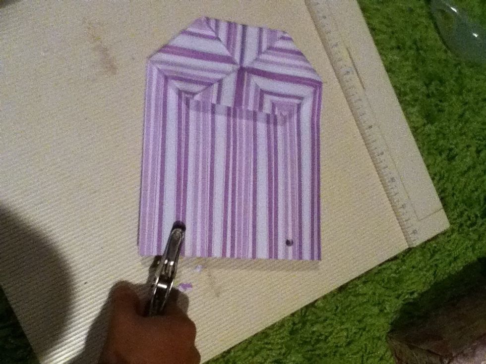 Punch two holes through both layers of the top of your bag.