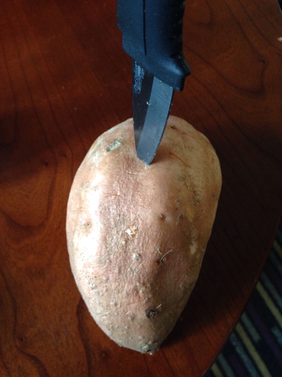 Puncture holes throughout the sweet potato with a knife or fork