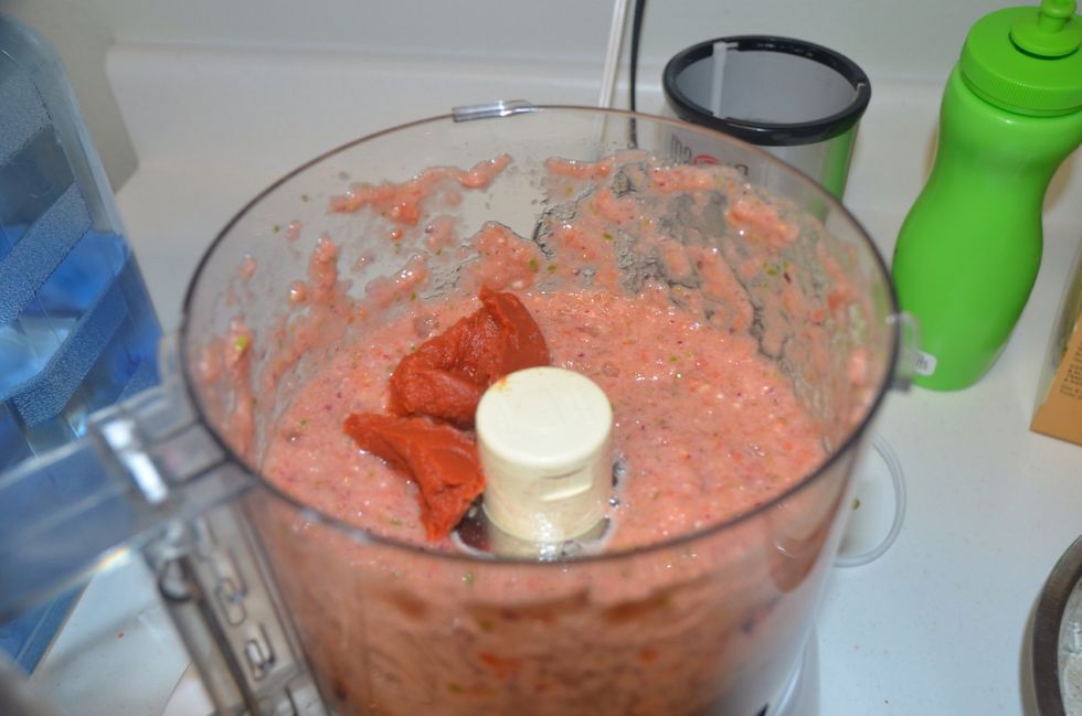 Pur\u00e9e will look something like this.. Then add the tomato paste. (Tomato paste gives a nice dark red color and enhances the flavor.)