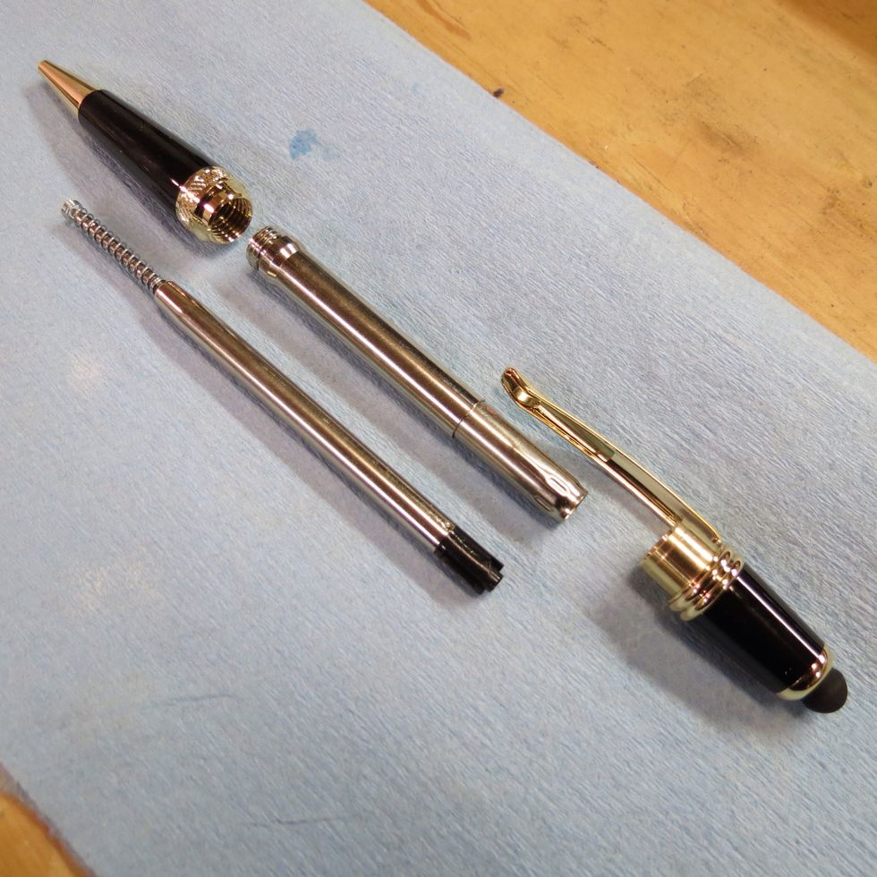 Purchase a pen kit from a supplier. I buy mine from Woodcraft or Penn State Industries. The kit comes with detailed instructions.