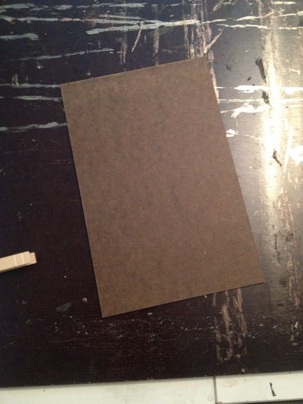 Purchase unfinished hardboard or masonite panels from your local home improvement store. Use a table saw or a friend with a table saw to cut them down to size.