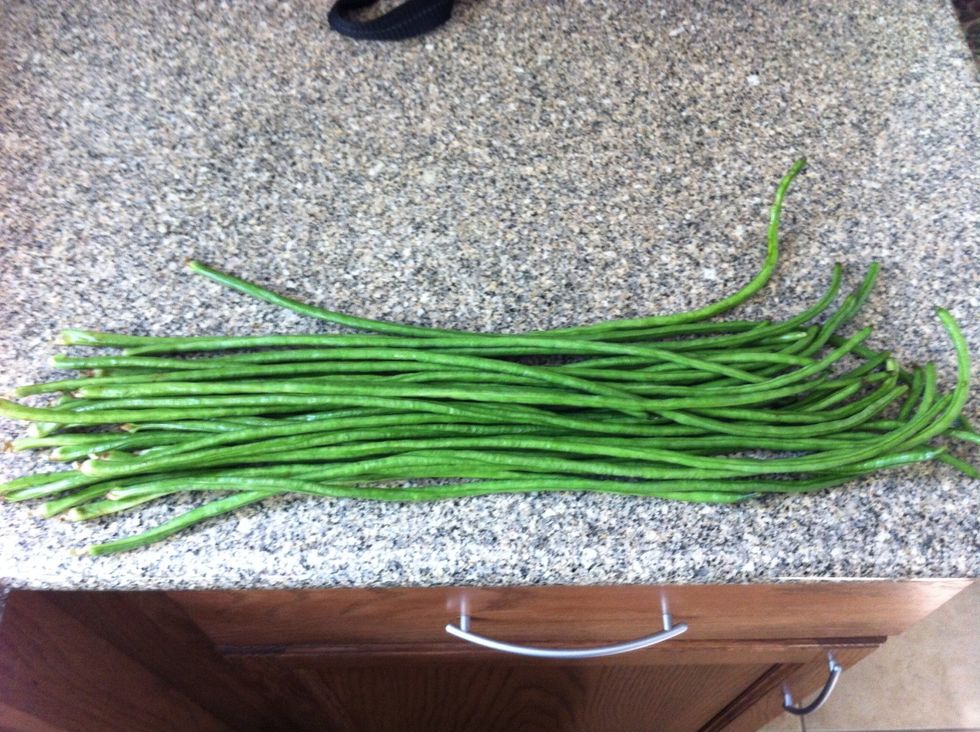 Purchase your fresh Chinese green beans at an Asian market or your local grocer's produce department.