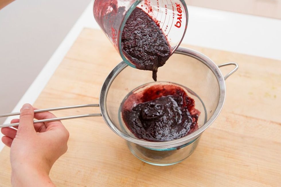 Puree the blackberries in the blender and then strain the mixture through your sieve.
