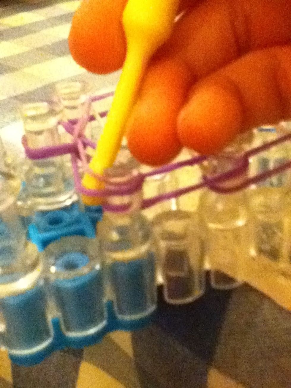 Push all the bands, except purple one that is on the bottom