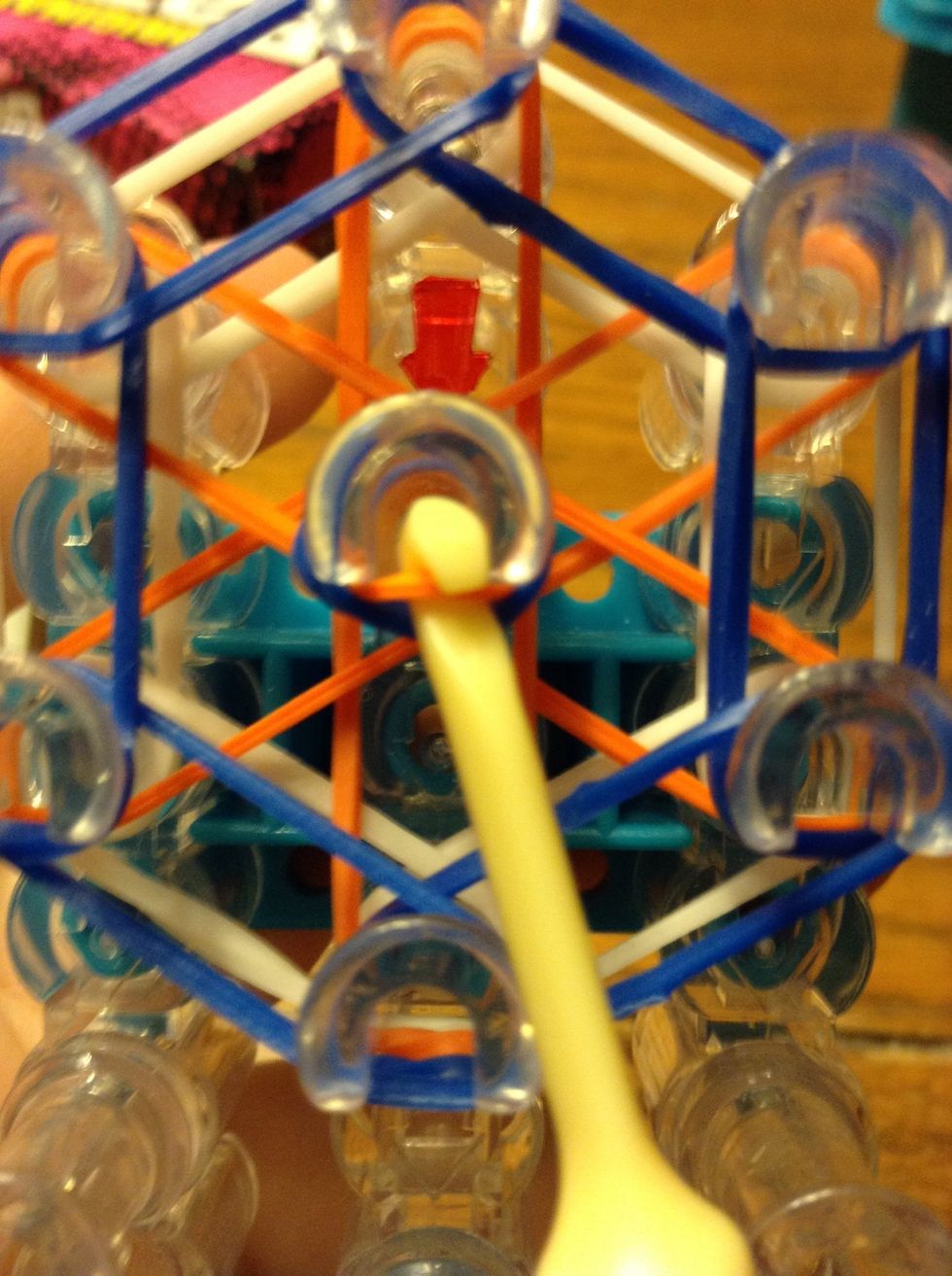 Push back that cap band and hook the top orange (or any color you have put on).