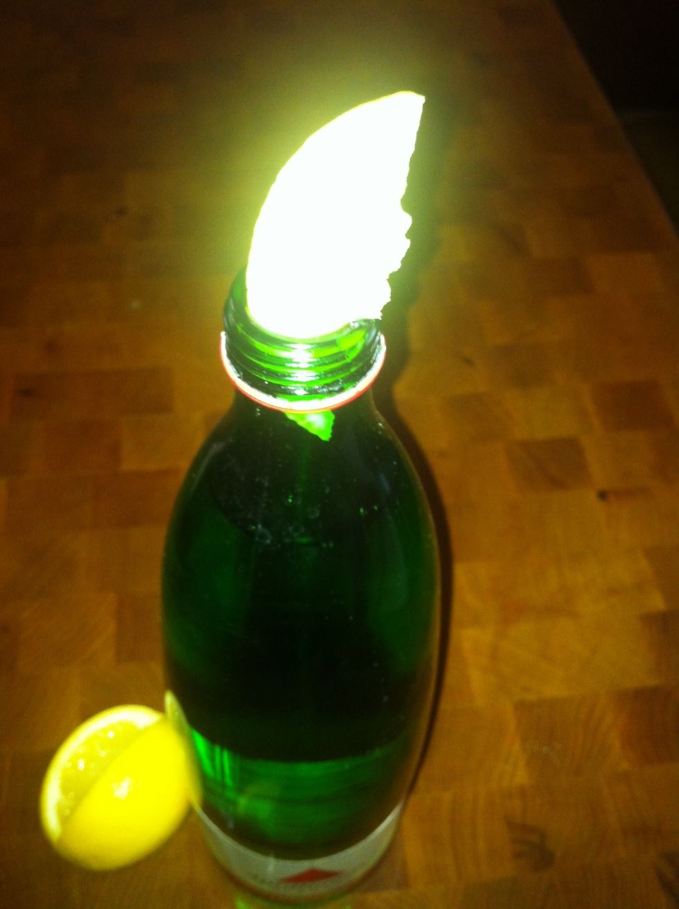 Push into top of bottle. (pushing from the bottom is much harder ;-p)
