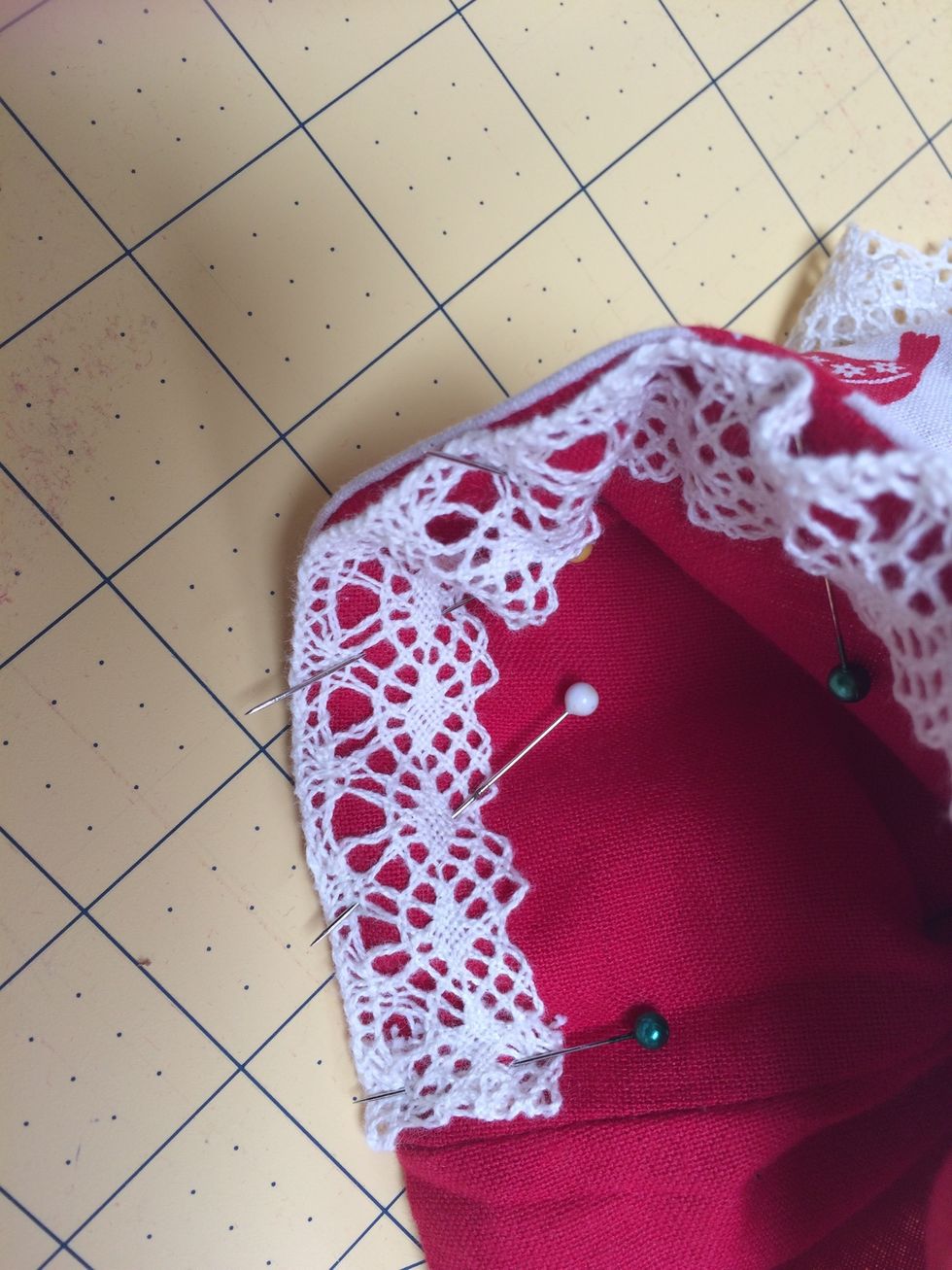 Push lining foot into main foot between the two batting and press . Sew lace along top edge on lining side .