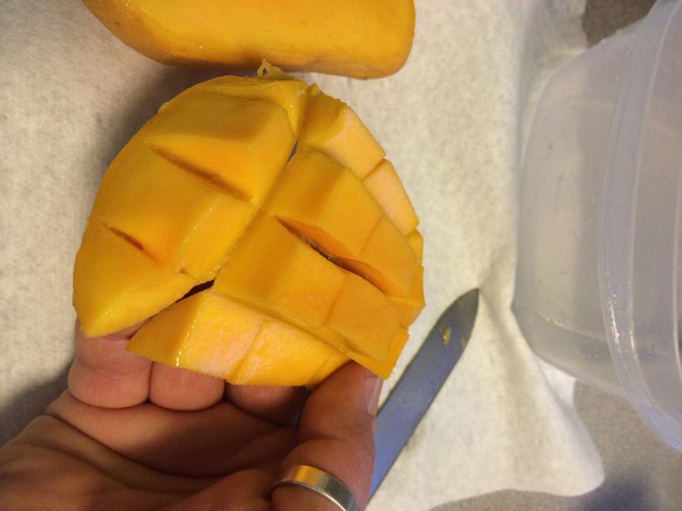 Push on skin to pop flesh out and you can eat the squares. Have a paper towel handy!