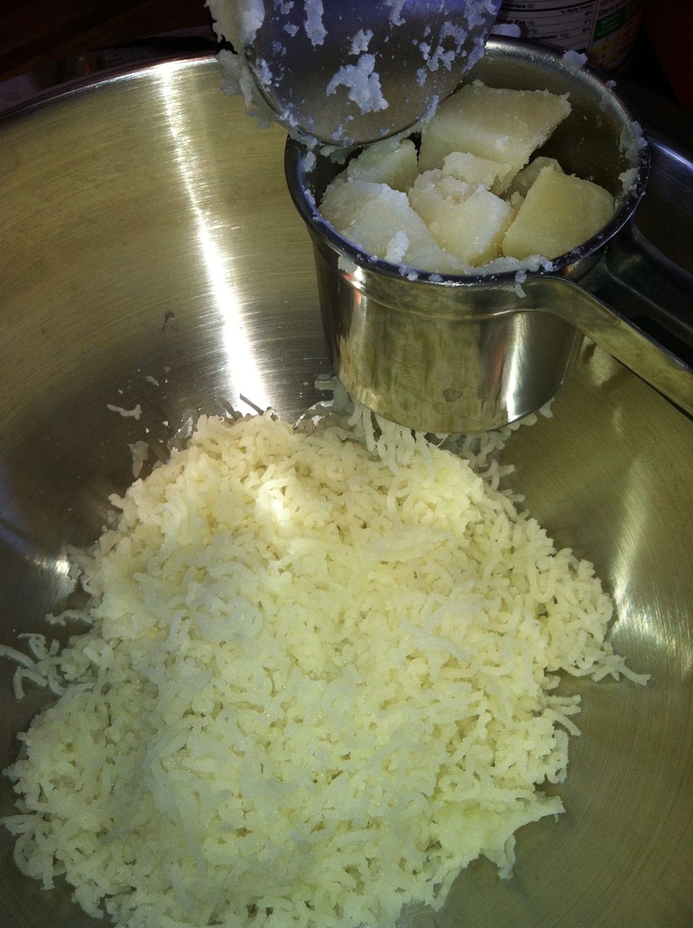 Push potatoes through ricer or do a fine mash